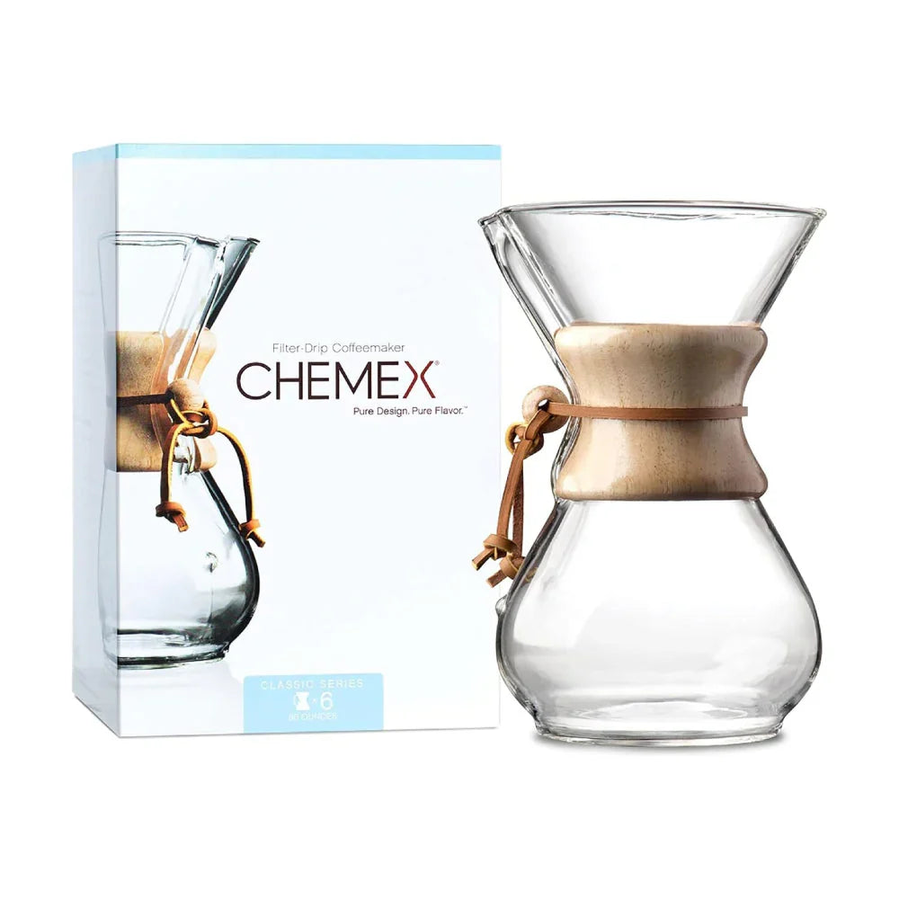 Chemex Classic Series 6-cup pour-over coffeemaker with the signature wood collar and leather cord. Packing case image