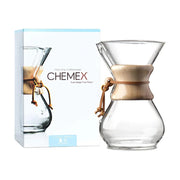 Chemex Classic Series 6-cup pour-over coffeemaker with the signature wood collar and leather cord. Packing case image