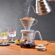 Hario V60 Coffee Server 02 Set Pale Grey putting water into the manual brewer