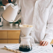 White ceramic Hario V60 pour-over set with a size 02 dripper for superior heat retention and a heatproof glass carafe. imagae 3