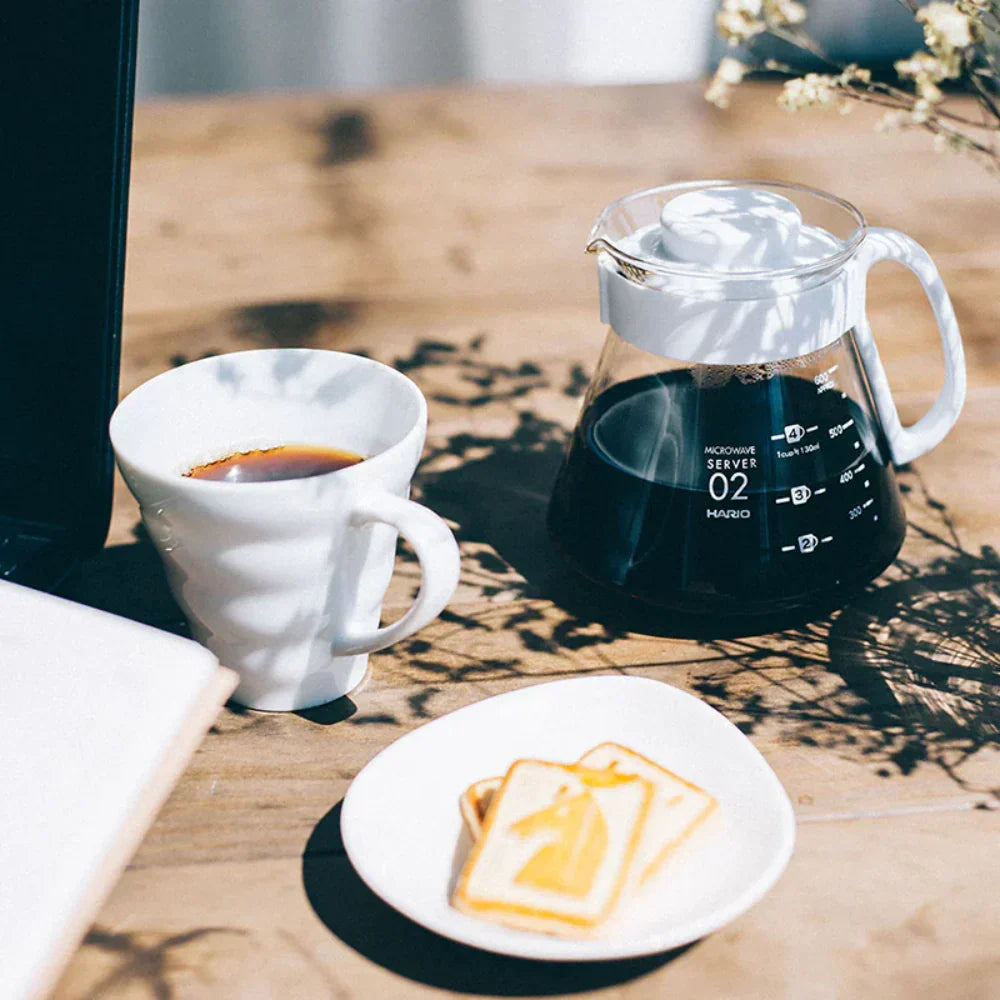 White ceramic Hario V60 pour-over set with a size 02 dripper for superior heat retention and a heatproof glass carafe. image 4