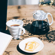 White ceramic Hario V60 pour-over set with a size 02 dripper for superior heat retention and a heatproof glass carafe. image 4