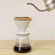 White ceramic Hario V60 pour-over set with a size 02 dripper for superior heat retention and a heatproof glass carafe. image 5